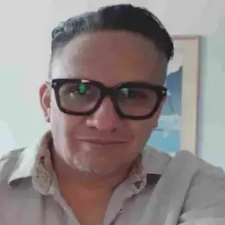 Man smiling while sharing positive feedback